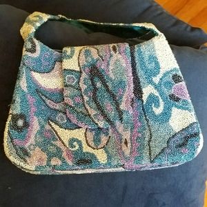Beaded statement purse with zippers & flap clasp.